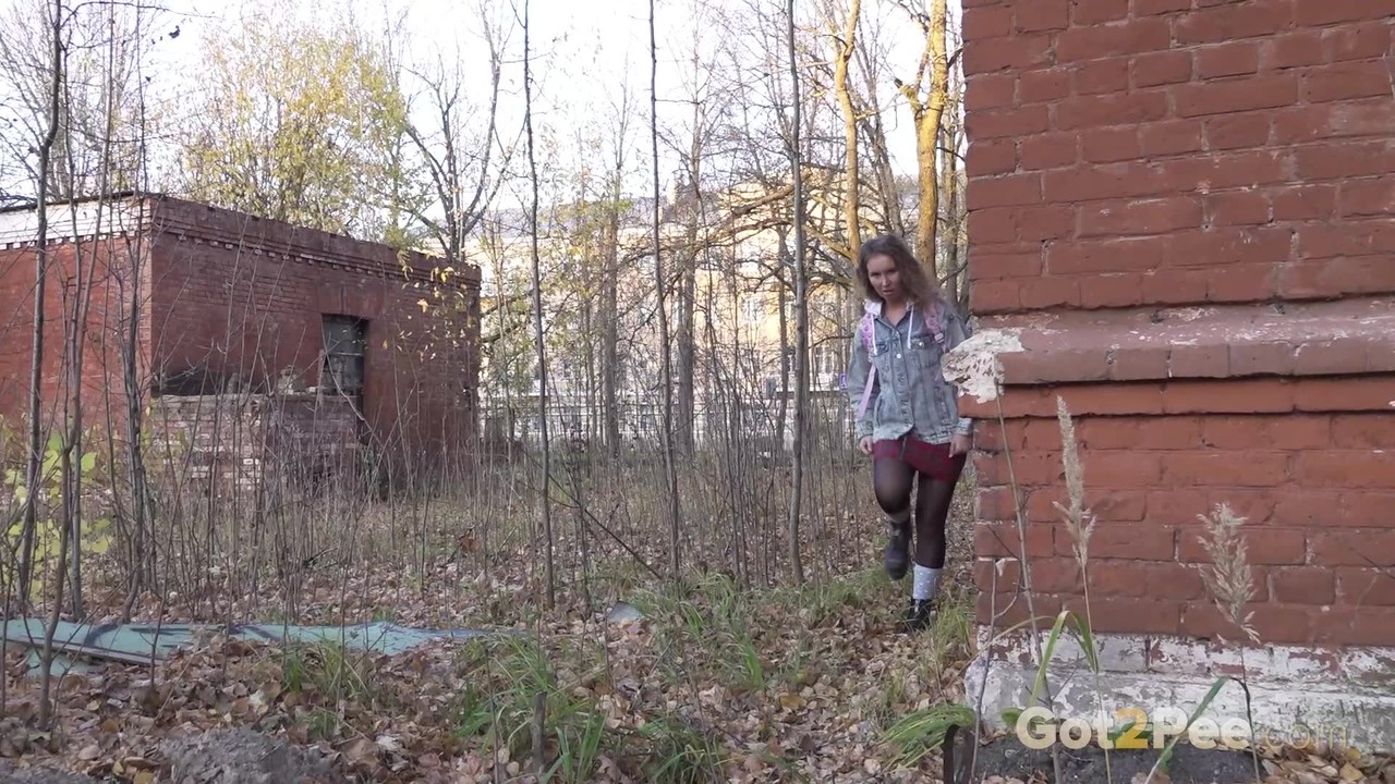 White girl Rita bares her bum while taking a piss by an abandoned building foto porno #425341839