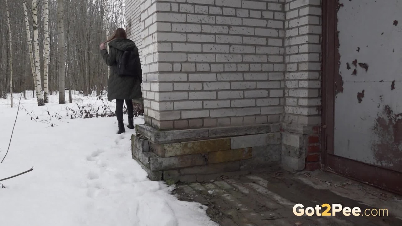Caucasian girl Valya takes a piss next to a building during the winter porno fotoğrafı #426334254
