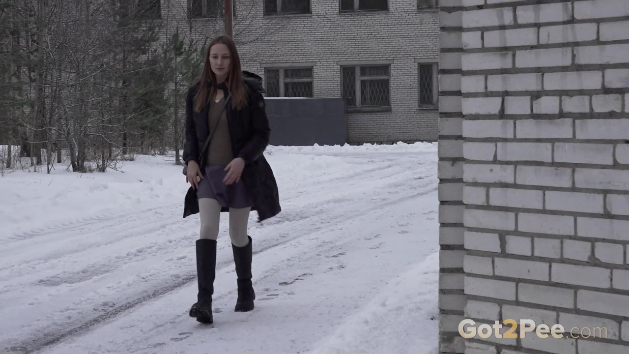 Caucasian girl Valya takes a piss in the snow after ducking behind a building порно фото #427303312