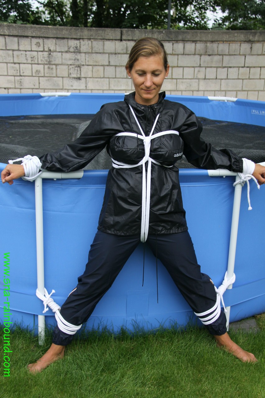 Amateur woman Sandra is gagged and tied to a pool in a raincoat photo porno #425389807