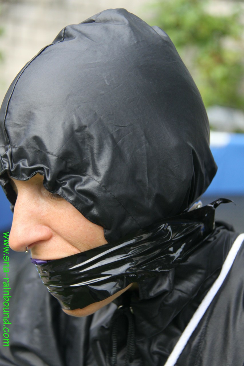 Amateur woman Sandra is gagged and tied to a pool in a raincoat photo porno #425389814