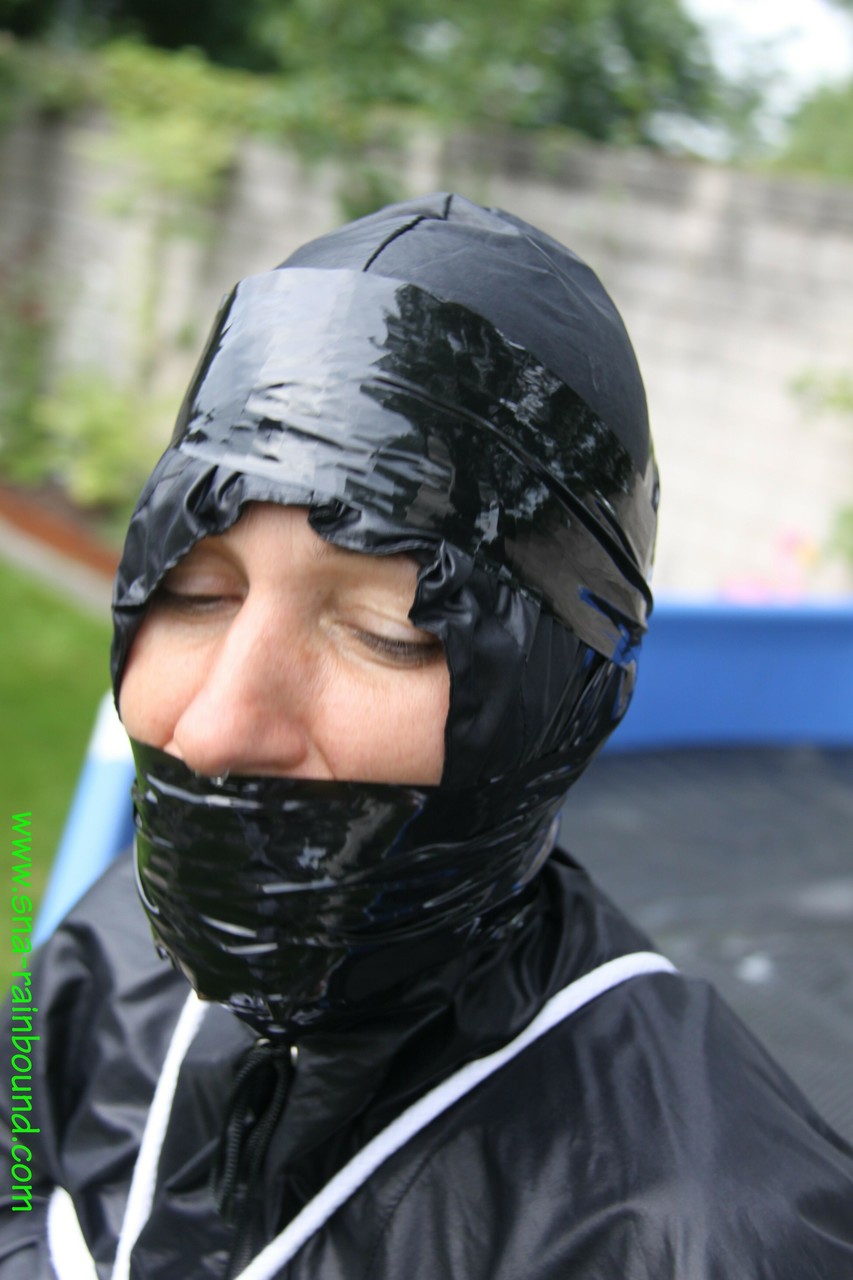 Amateur woman Sandra is gagged and tied to a pool in a raincoat photo porno #425389816