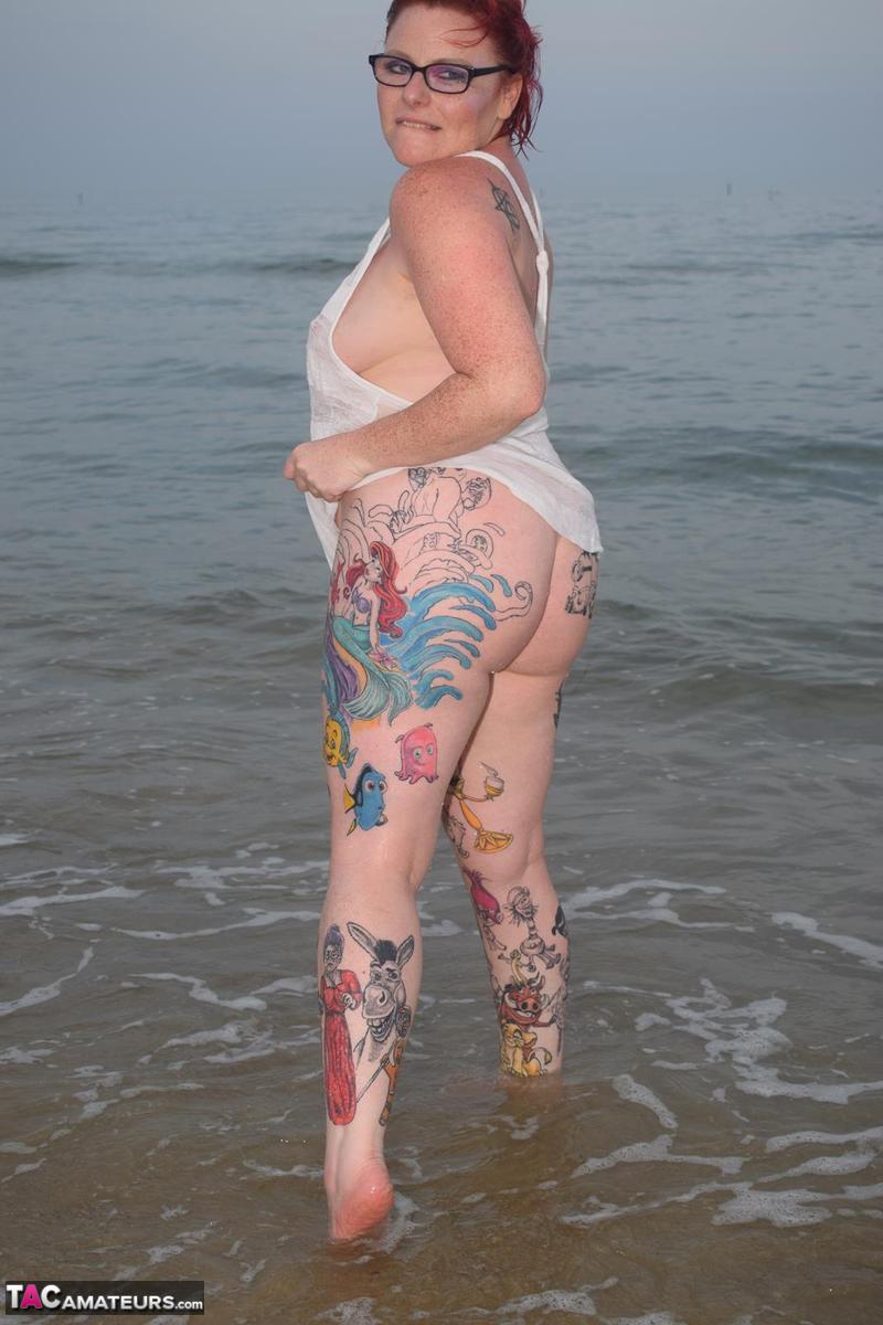 Mature redhead Mollie Foxxx wets her tattooed body in the ocean 포르노 사진 #428338789