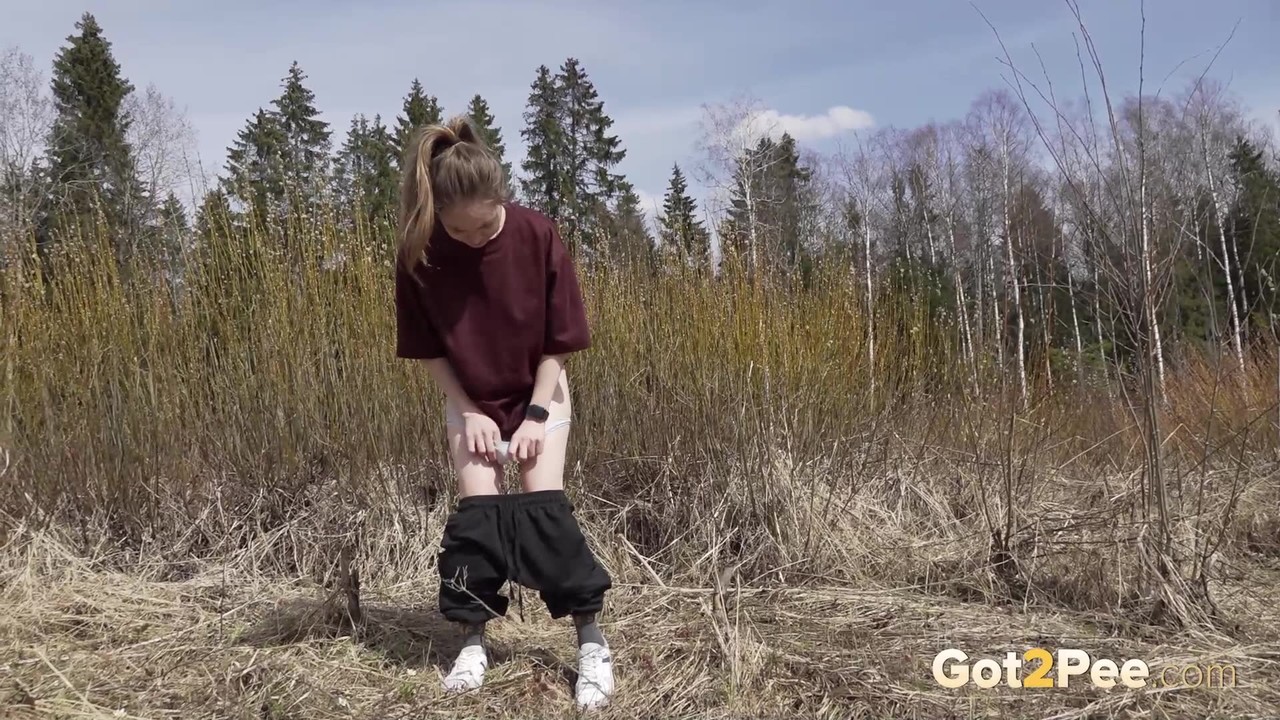 Fair Skinned Blonde Nastya Takes A Pee While Hiking In The Countryside