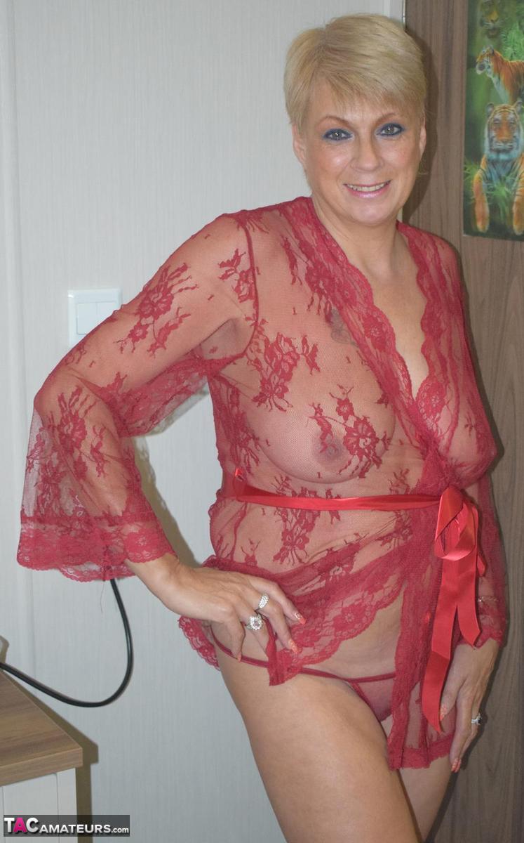 Mature blonde woman Dimonty looses her saggy tits from a sheer robe порно фото #423999452