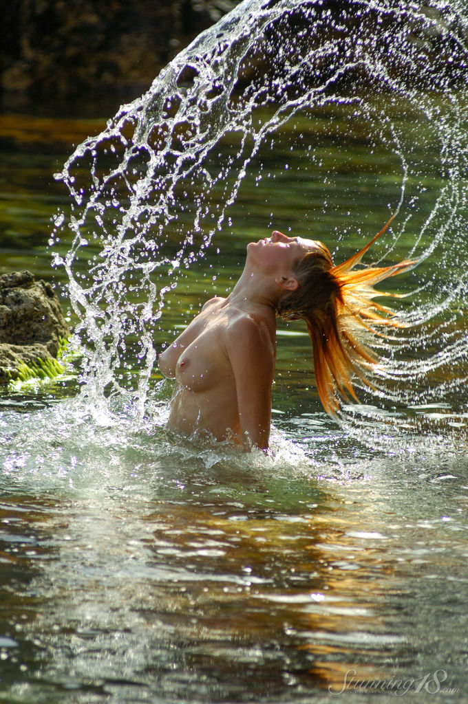18-year-old redhead Aure F splashes about while naked in the water porn photo #428398555