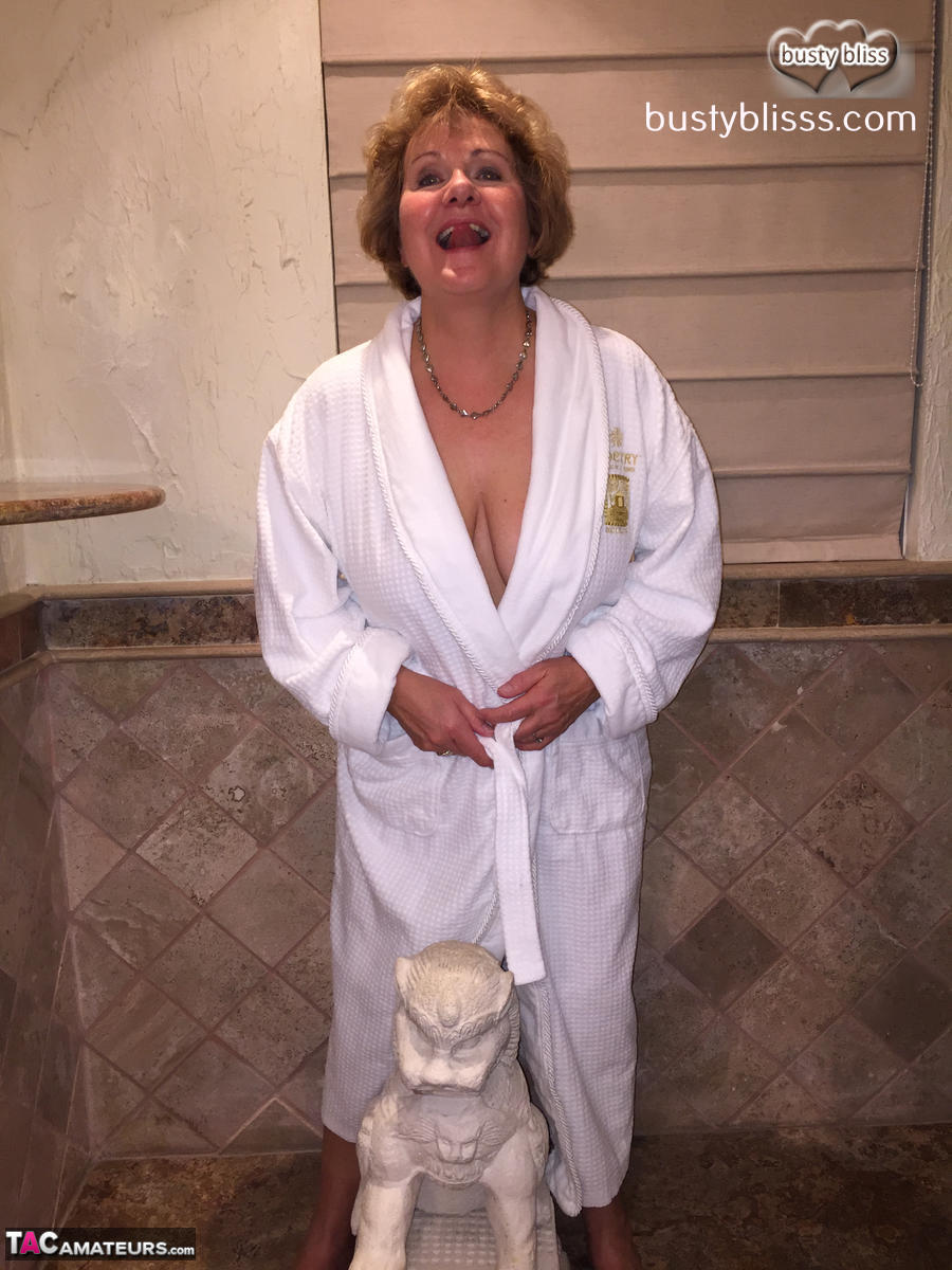 Older Woman Busty Bliss Releases Her Natural Tits From A White Bathrobe