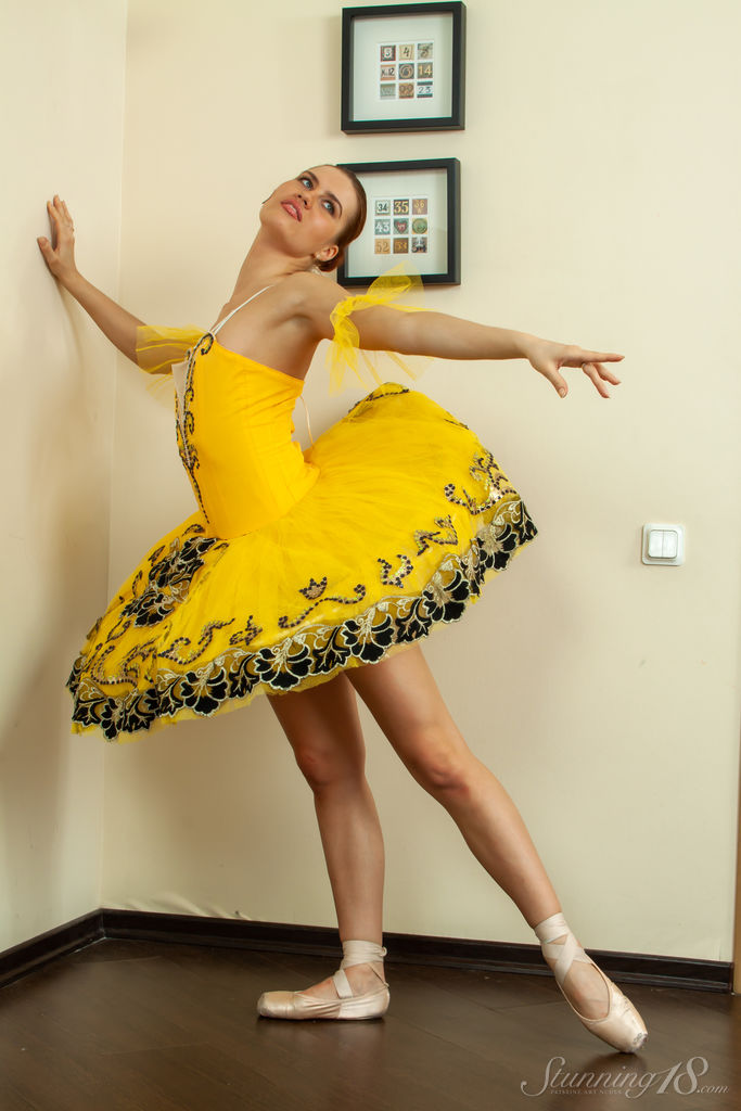 Ballerina Metis P strikes striking poses while removing her slippers.