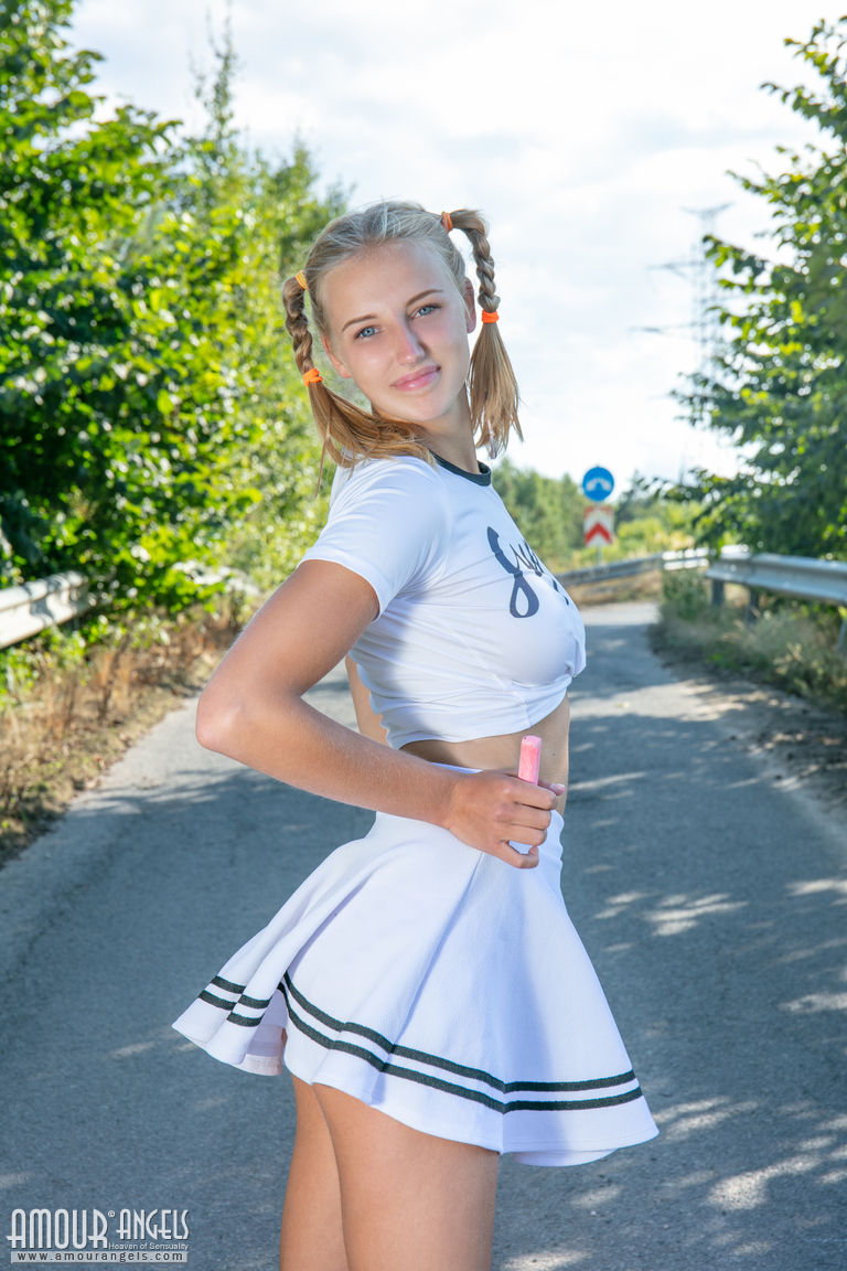 Blonde teen Nana strips to her socks and runners on a paved road porn photo #422473846