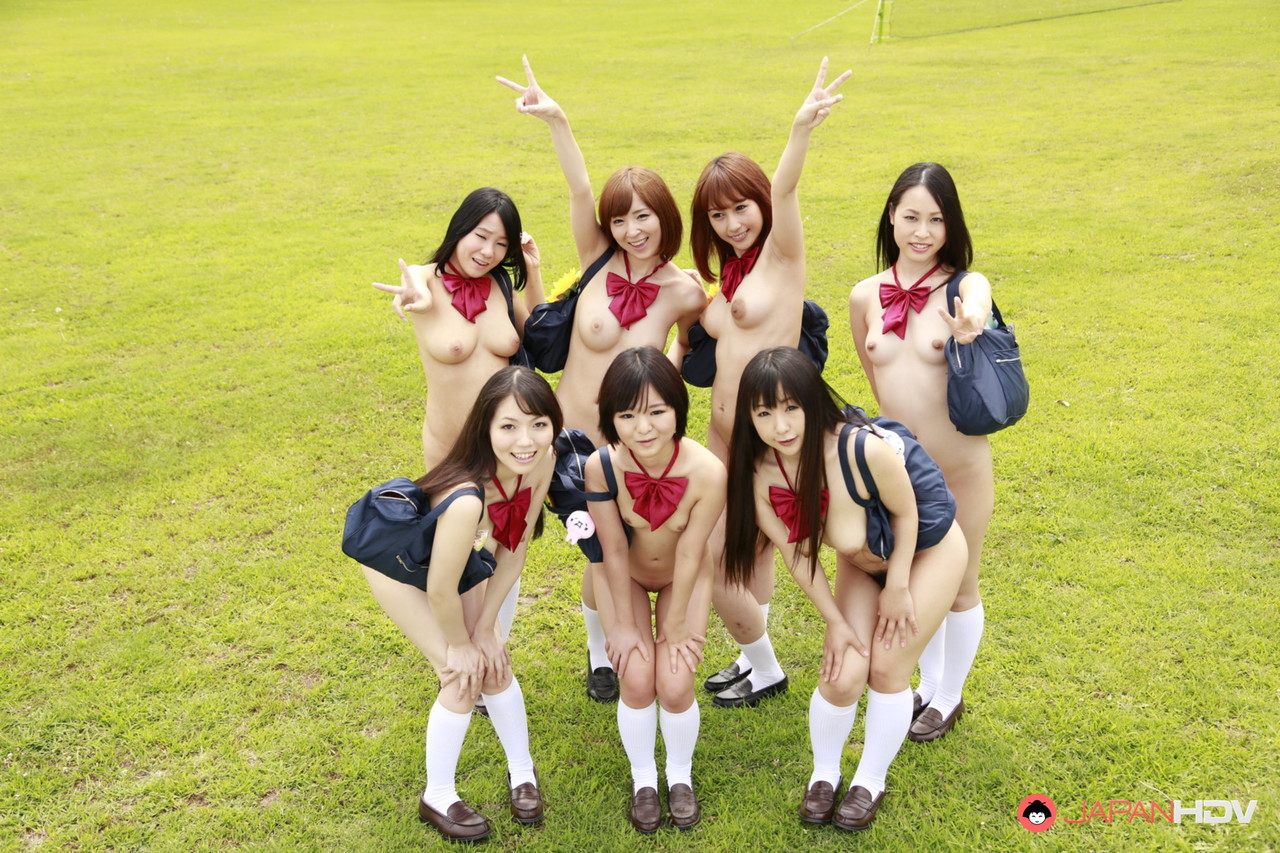 A Group Of Japanese Girls Pose Nude In A Field In White Socks