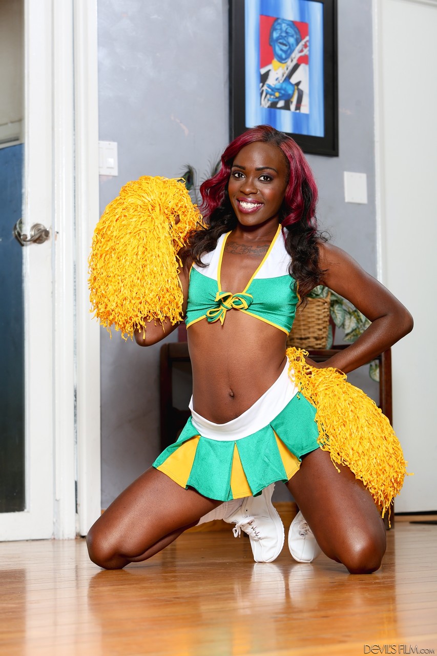 Slim ebony babe Bella Doll loves to preform in a cheerleader outfit porn photo #422983768