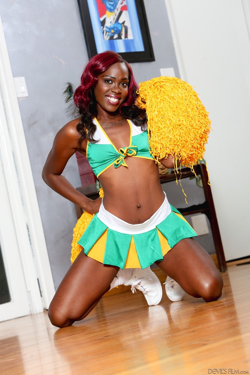 Slim ebony babe Bella Doll loves to preform in a cheerleader outfit porn photo #422983772
