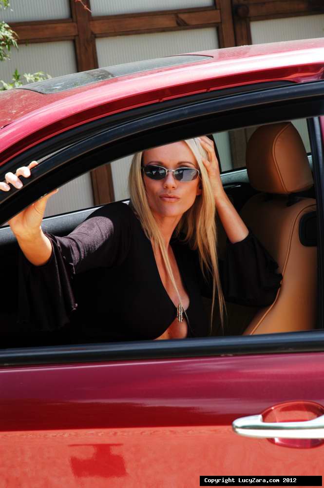 Hot blonde chick Lucy Zara flashes a no oanty upskirt in a sports car porno fotky #426179687