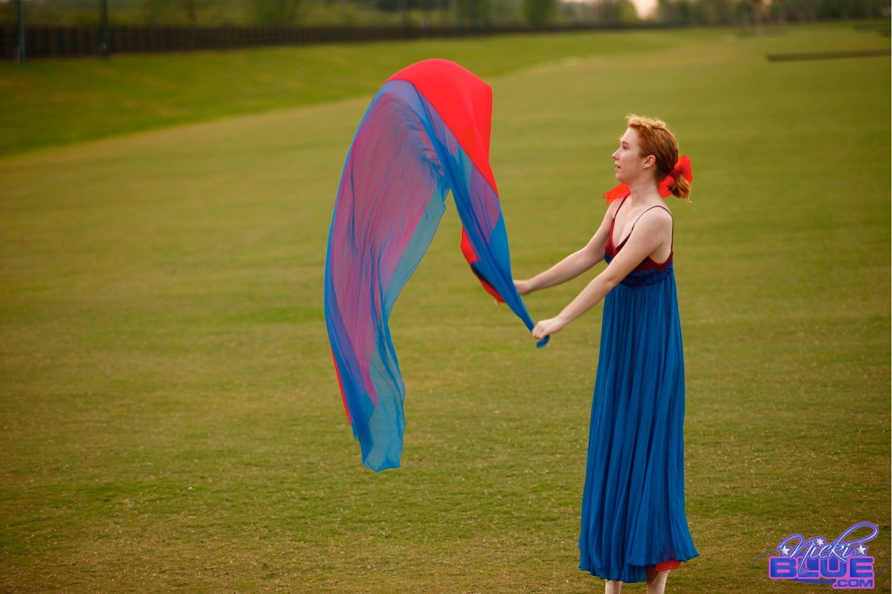 Natural redhead Nicki Blue works on her ballerina moves in an expansive field porn photo #429166234