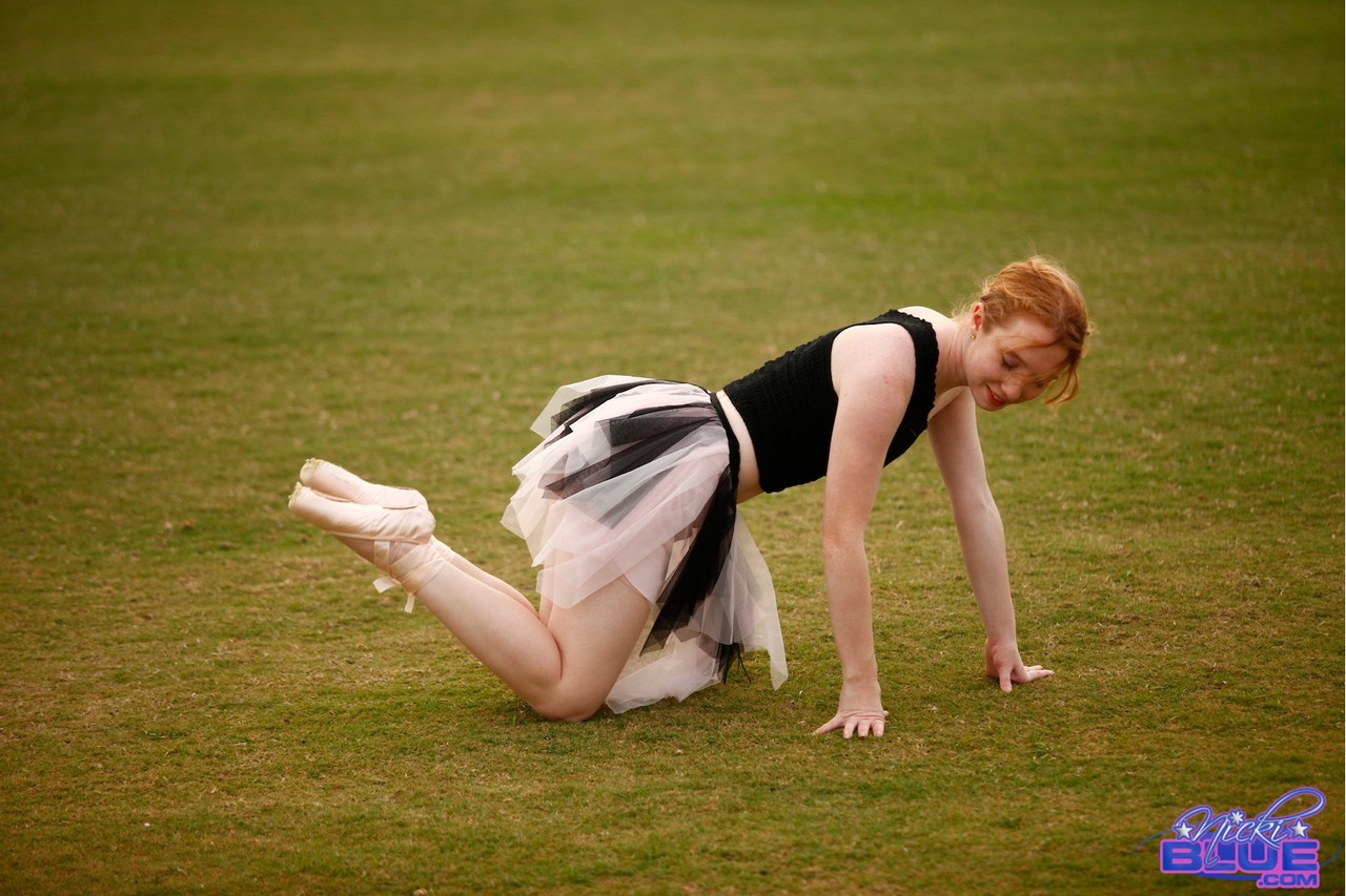 Natural redhead Nicki Blue works on her ballerina moves in an expansive field porn photo #429166242