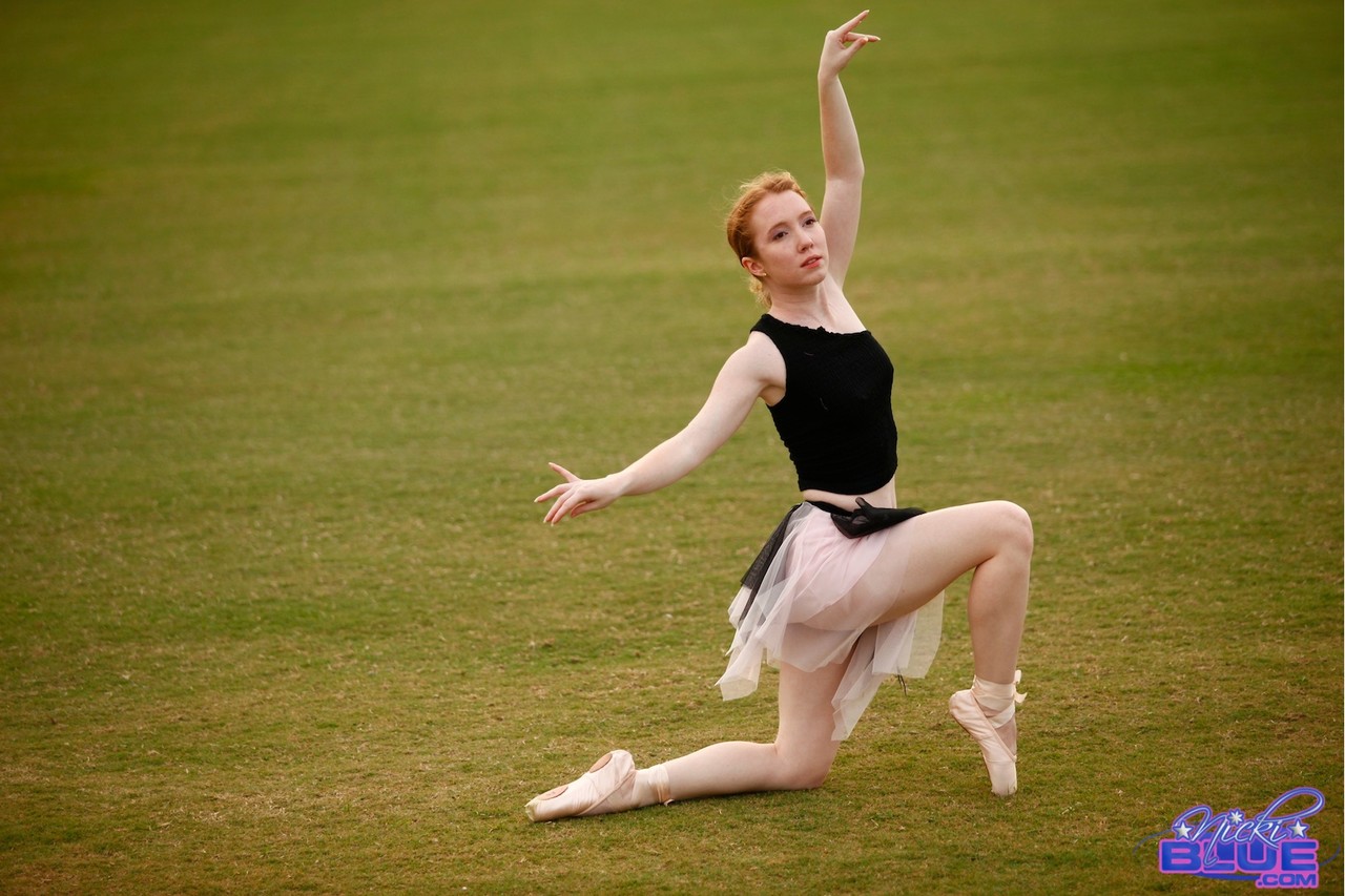 Natural redhead Nicki Blue works on her ballerina moves in an expansive field porn photo #429036836