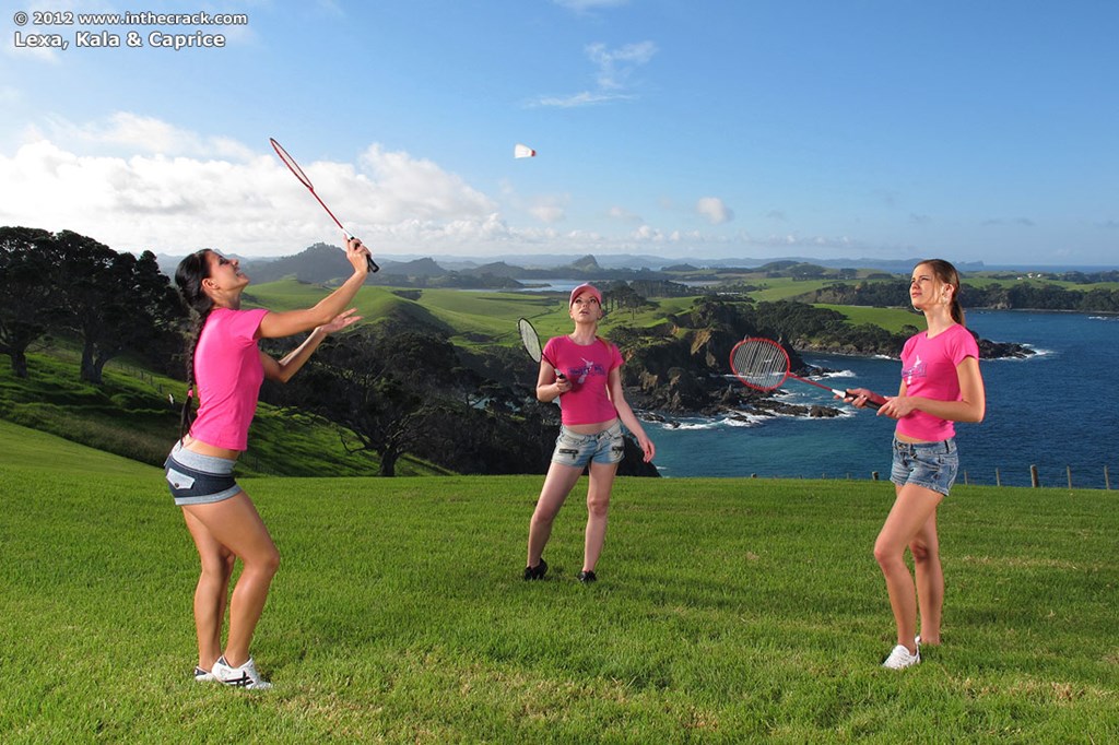Three girls expose their perfect asses while playing badminton on a lawn foto porno #428268870