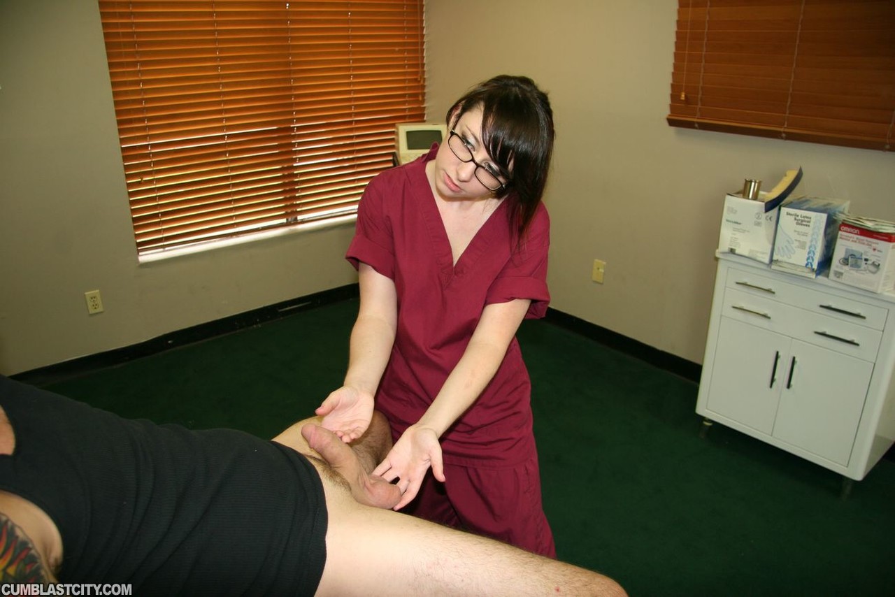 Young nurse Dakota Charms gives an injured man a handjob in a clinic photo porno #427374872