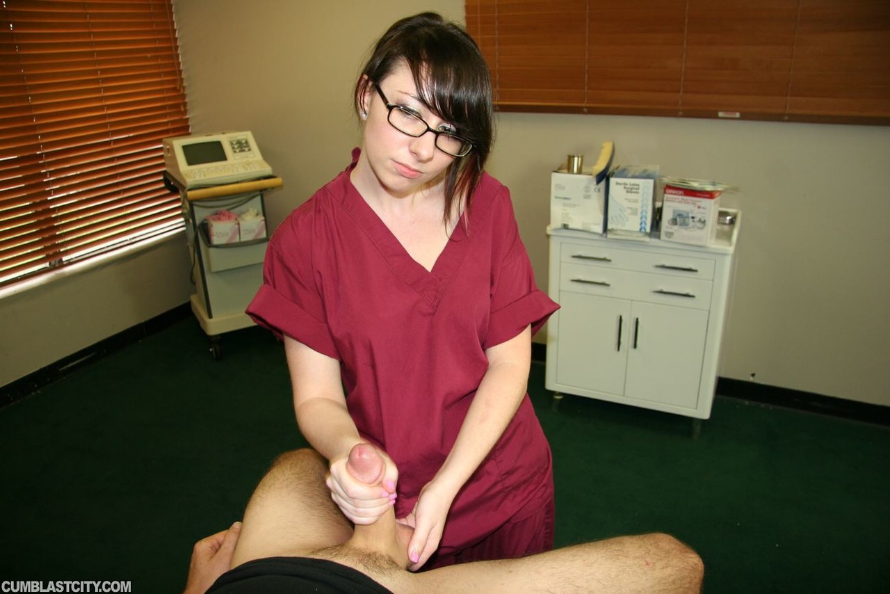 Young nurse Dakota Charms gives an injured man a handjob in a clinic photo porno #427374874
