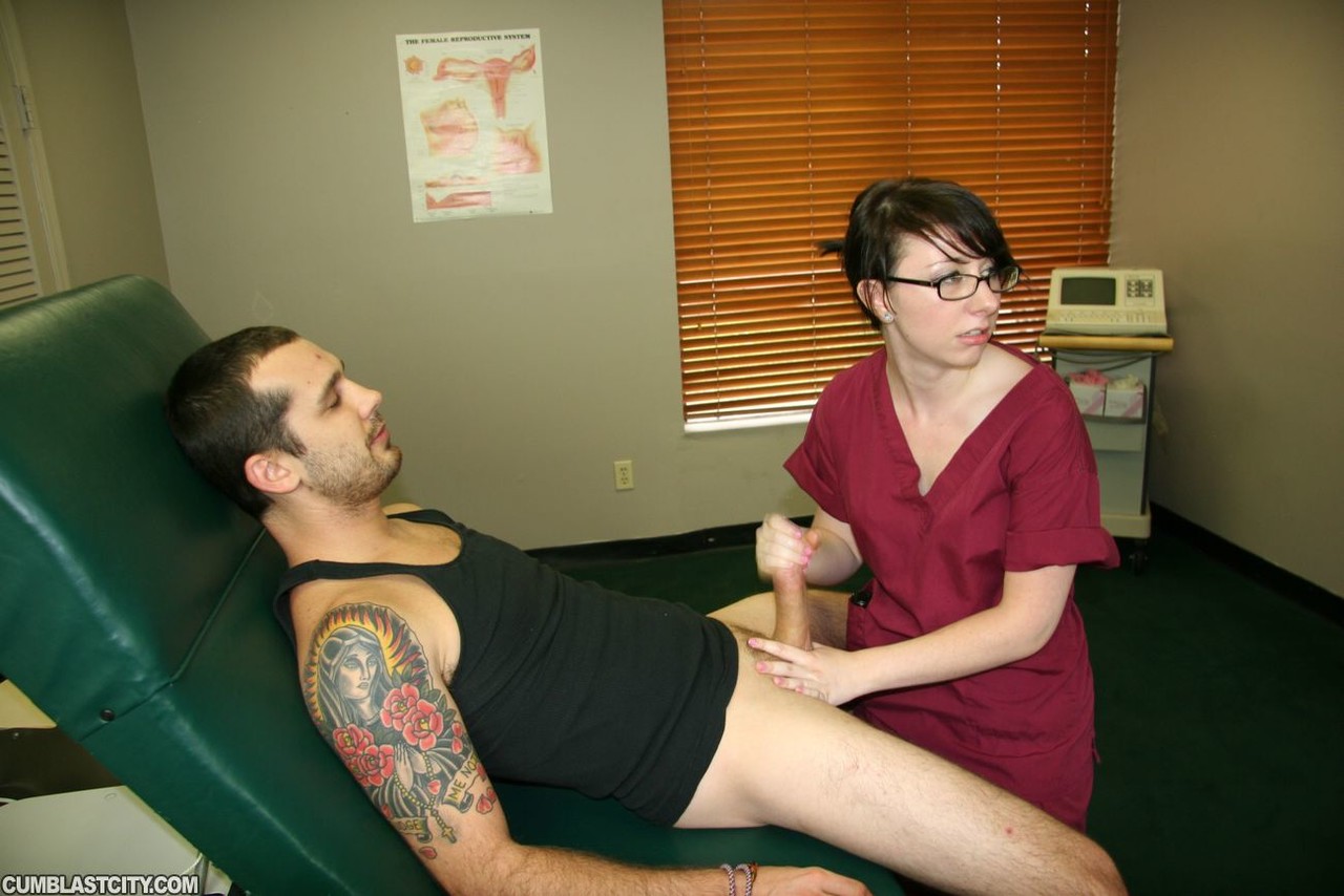 Young nurse Dakota Charms gives an injured man a handjob in a clinic photo porno #427374876