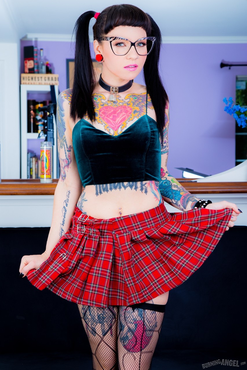 Tattooed Necro Nicki in pigtails & short skirt on knees showing tight ass foto porno #422617372