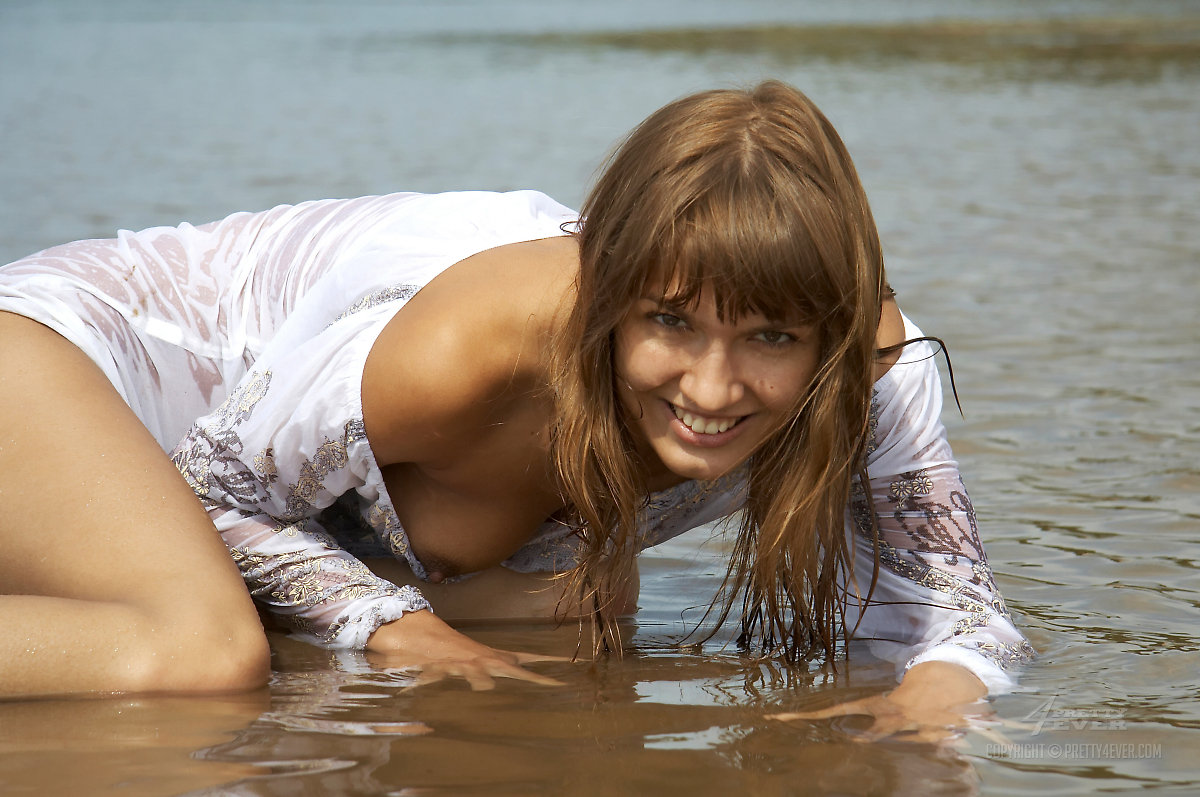 Young beauty Alena models in shallow water during solo action porn photo #426890275