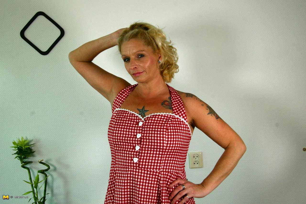 Older Dutch housewife hikes up her dress before sucking on a dildo foto porno #426747614
