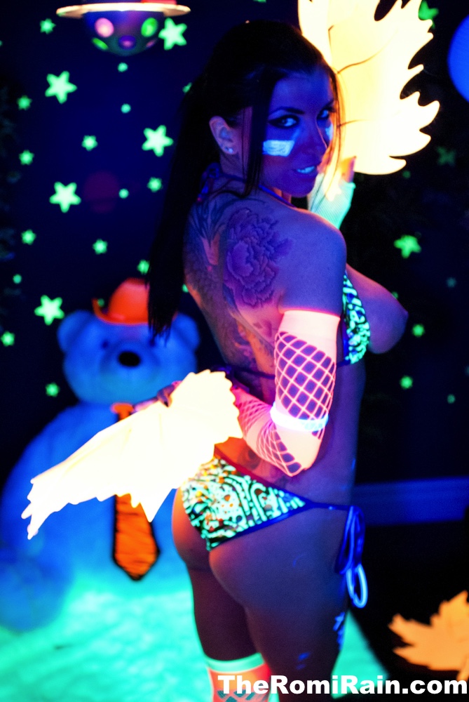 Hot MILF Romi Rain shows her big boobs underneath black-light porn photo #422570085