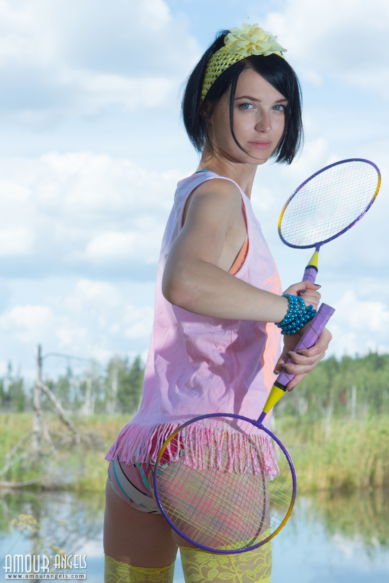 Dark haired teen girl lays down her badminton rackets and strips naked foto porno #424649330