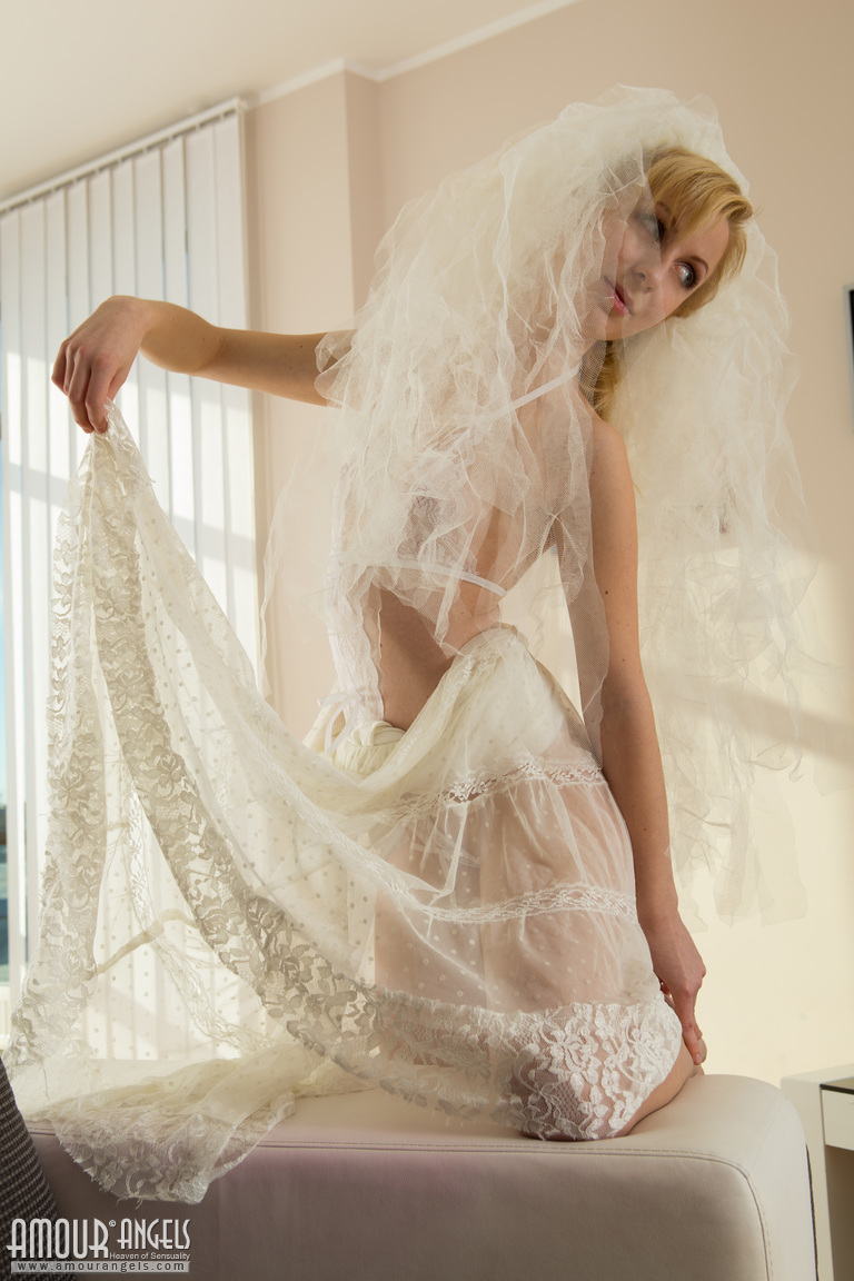 Wearing her sheer white lingerie, the beautiful bride Toni spreads herself naked.