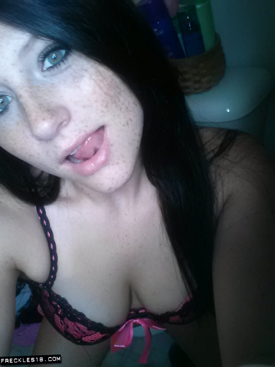 Self shot of amateur Freckles in stockings and sexy lingerie showing tongue photo