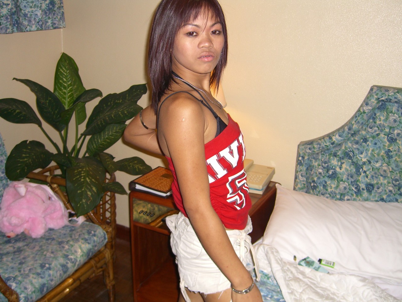Filipina amateur licks her lips while getting totally naked on a bed porn photo #426918642