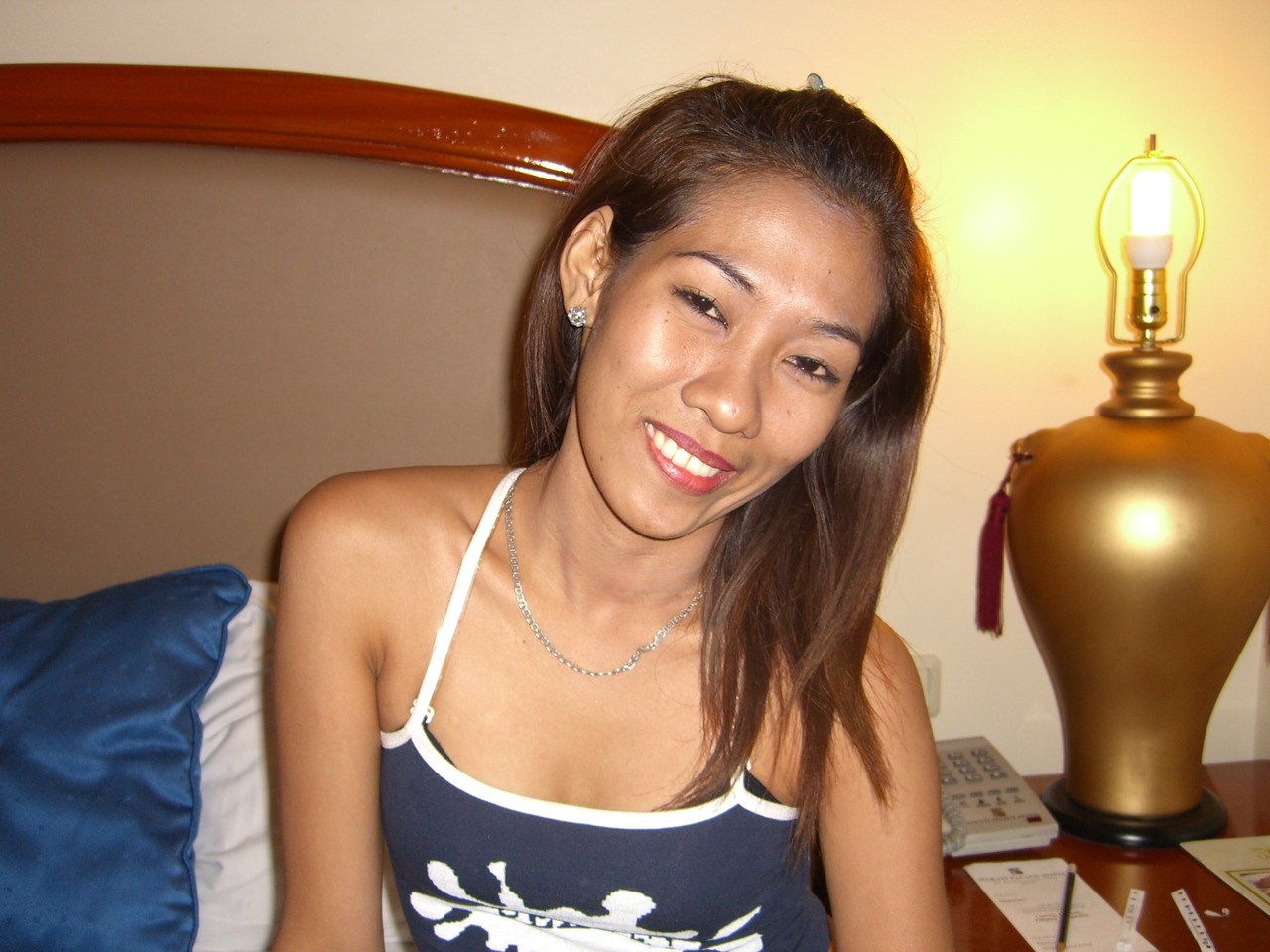 Uncommonly awakened Asian performer lays down on white sheets for the first time, without any clothing or accessories.