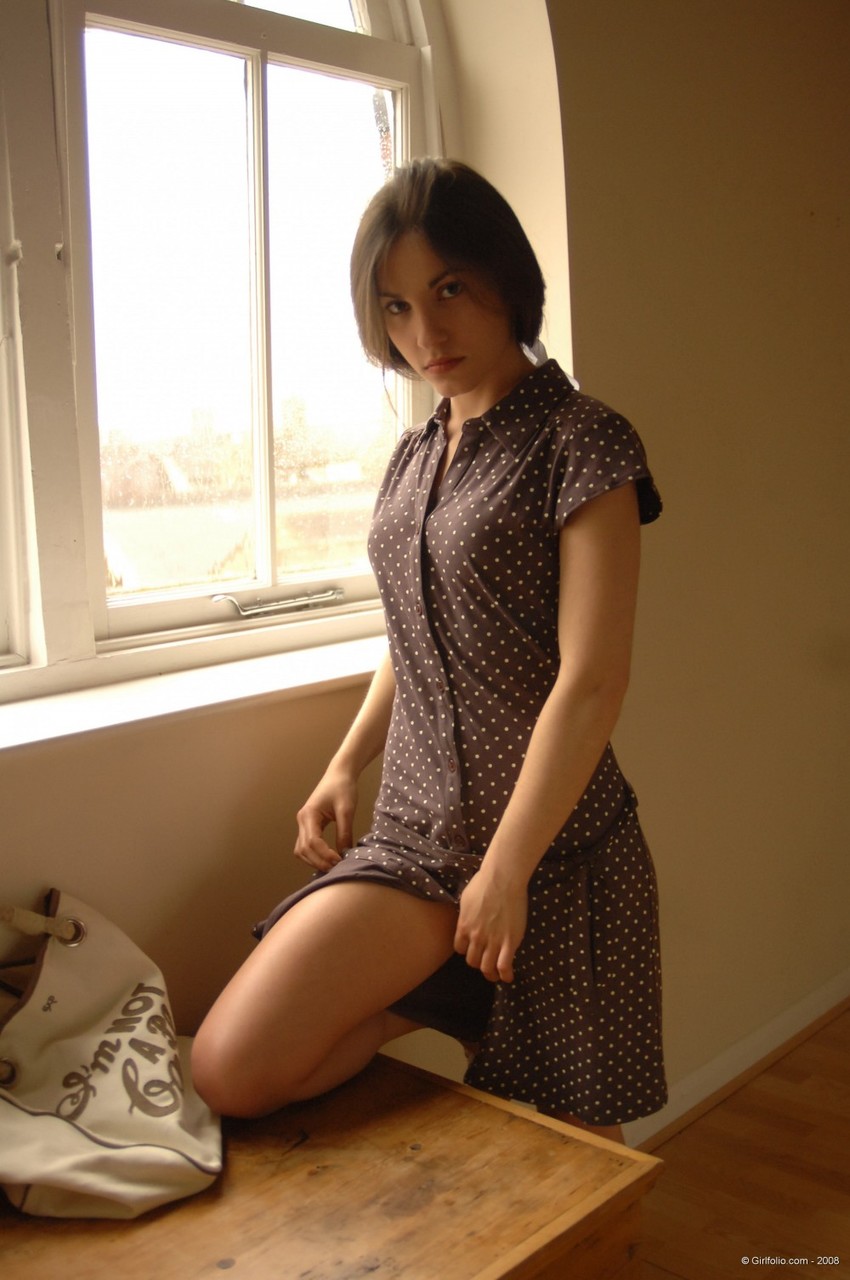 Solo girl slips off her dress and underthings in front of a window porn photo #424936795