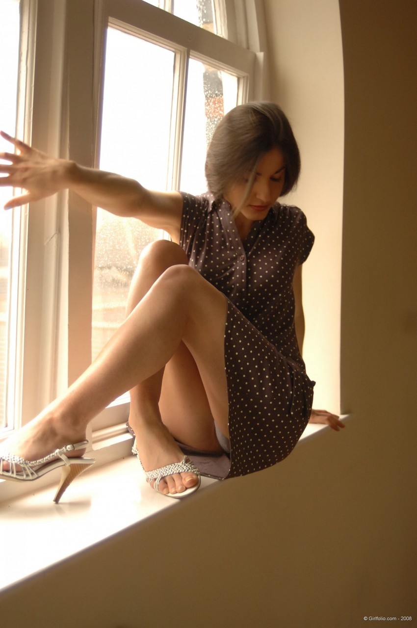 Solo girl slips off her dress and underthings in front of a window ポルノ写真 #424936797