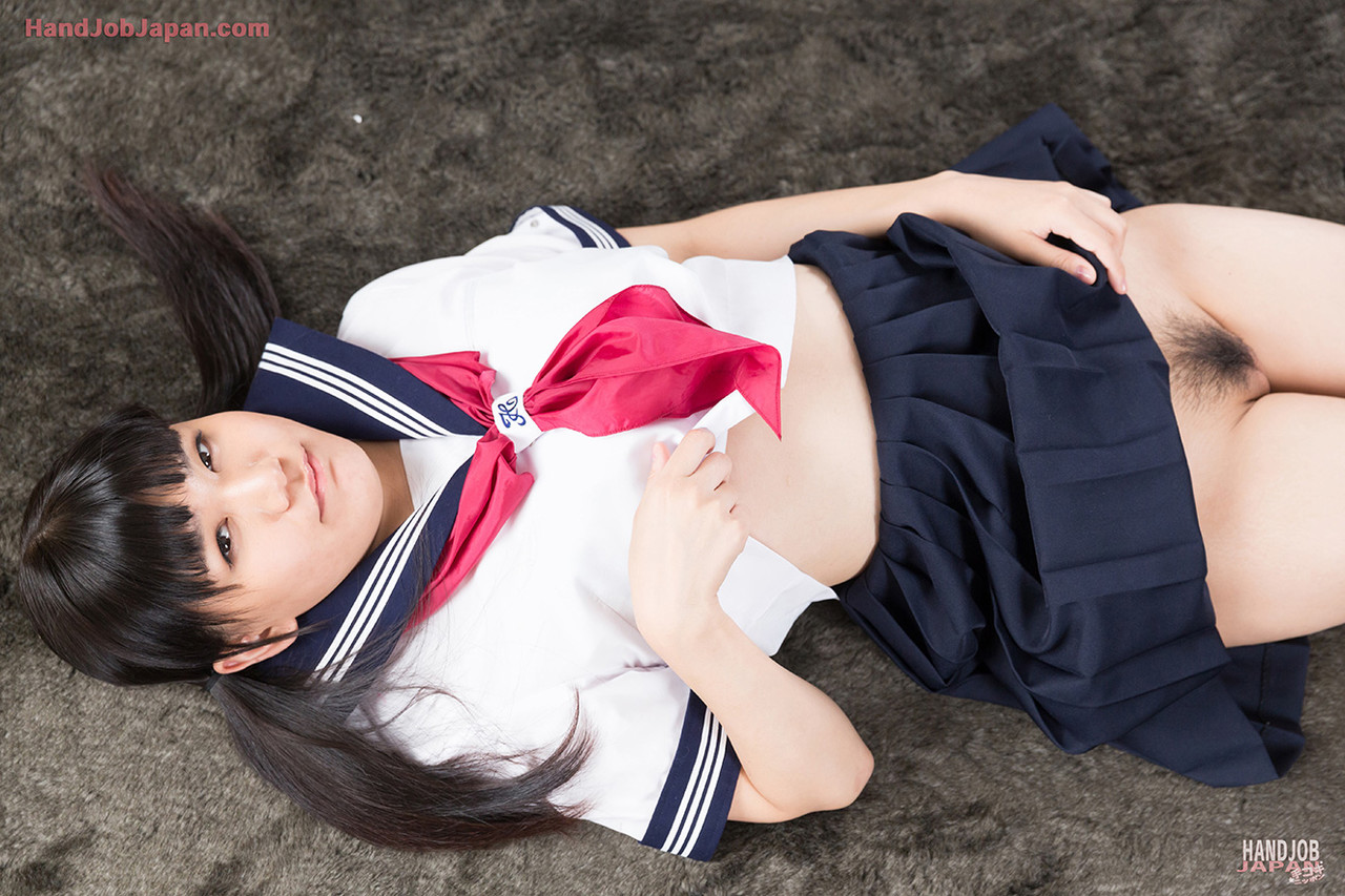 Cute Japanese schoolgirl bares her pussy before getting cum on face after a HJ porno foto #429088650