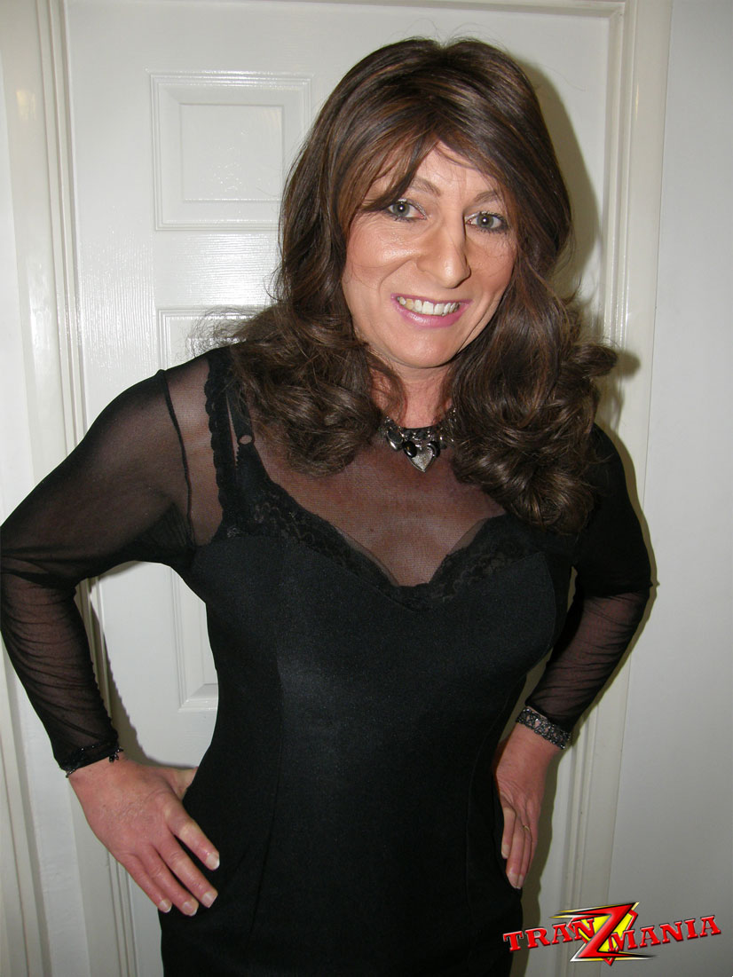 Gorgeous Brunette Crossdresser Teasing In A Pair Of Black Nylons And Matching