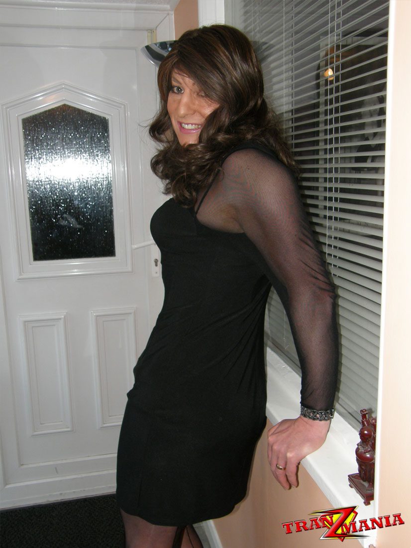 Gorgeous Brunette Crossdresser Teasing In A Pair Of Black Nylons And Matching