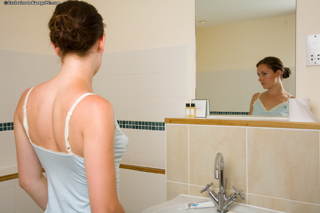 Dancing amateurish, with a polished rear end, taking a shower and washing off her clothes.