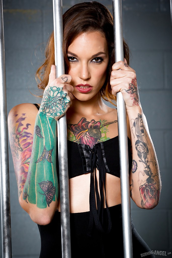 Tattooed babe in black stockings and velvet dress posing in prison cell zdjęcie porno #427753500