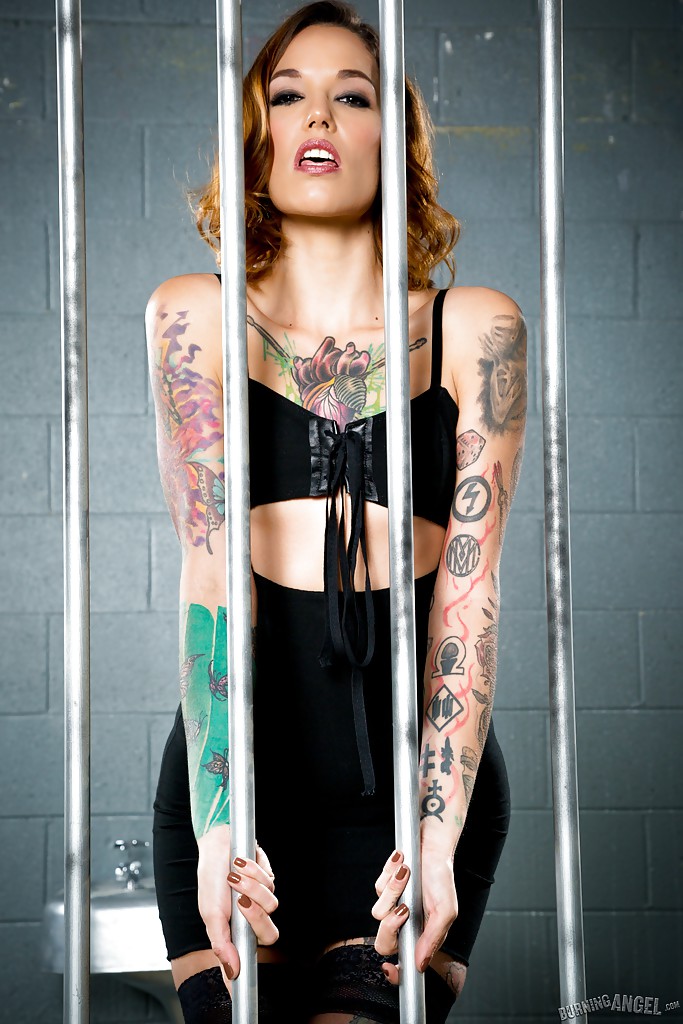 Tattooed babe in black stockings and velvet dress posing in prison cell zdjęcie porno #427753504