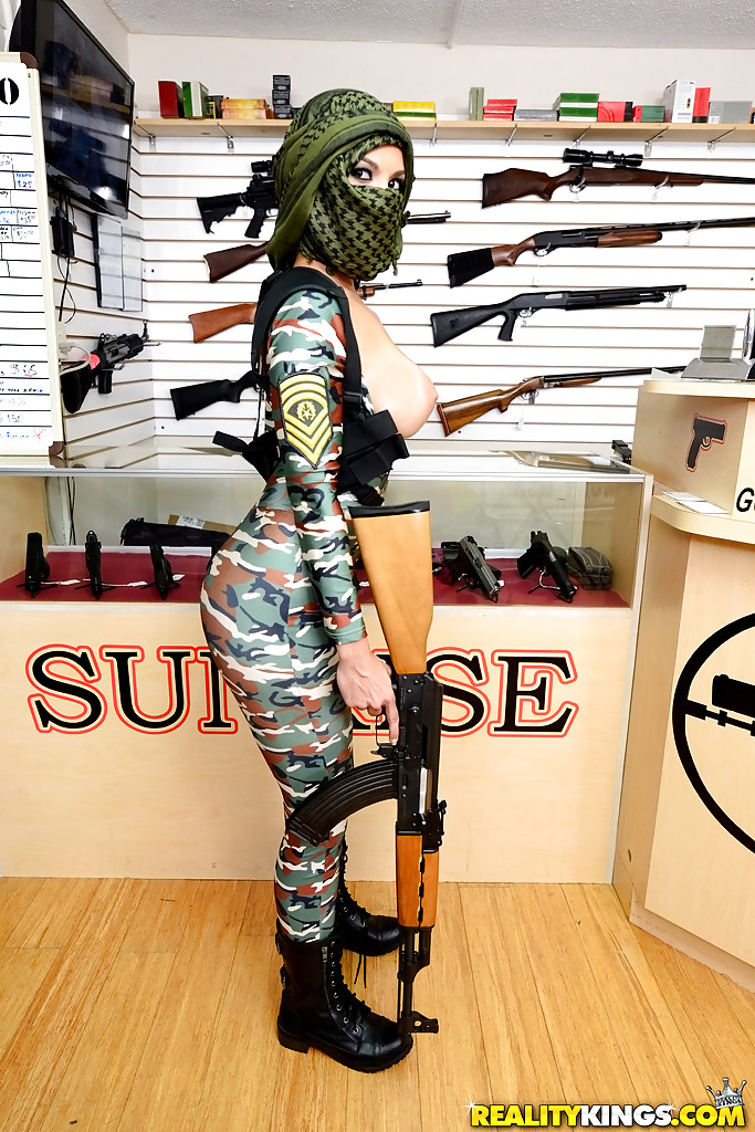 Camouflaged chick with rifle in hand lets her big natural breasts loose photo porno #429017606