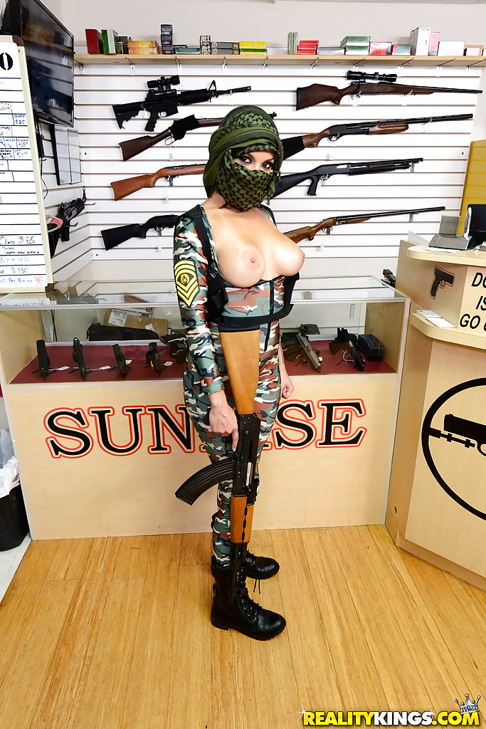 Camouflaged chick with rifle in hand lets her big natural breasts loose porn photo #429017612