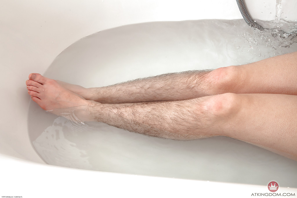 Hirsute Mature Broad Displaying Hairy Legs And Tiny Tits In Bathtub