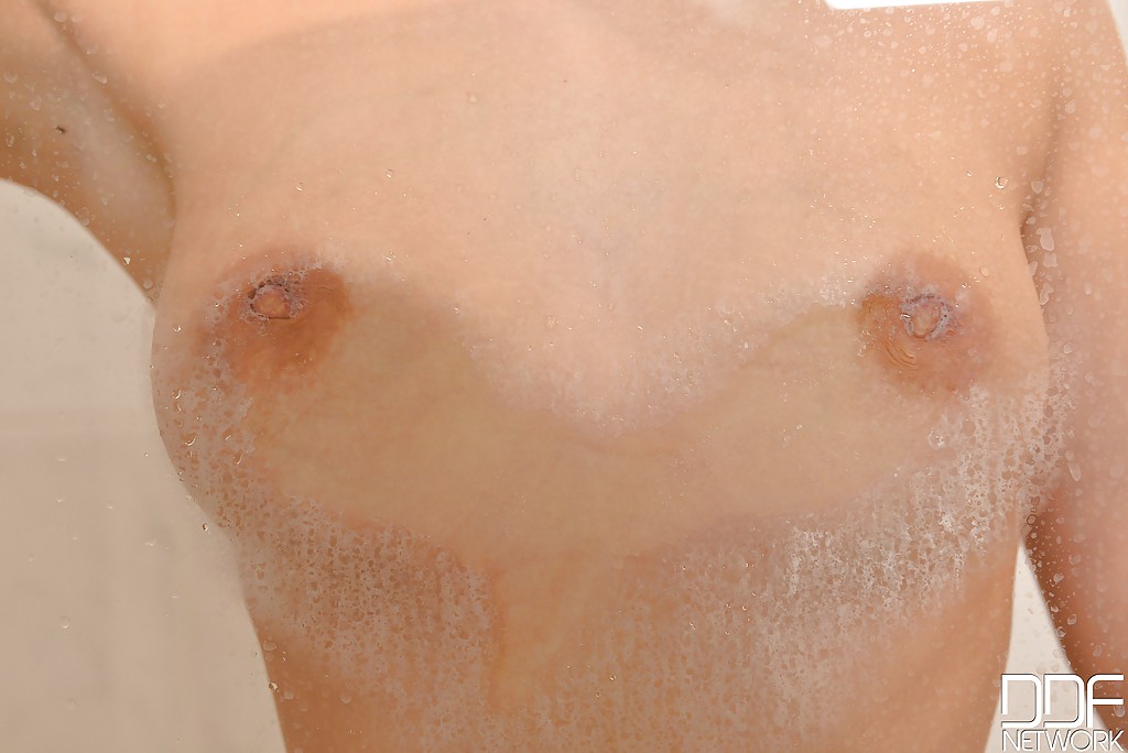 Wet European babe Ria Sunn displaying small tits while masturbating in bath porn photo #425685522