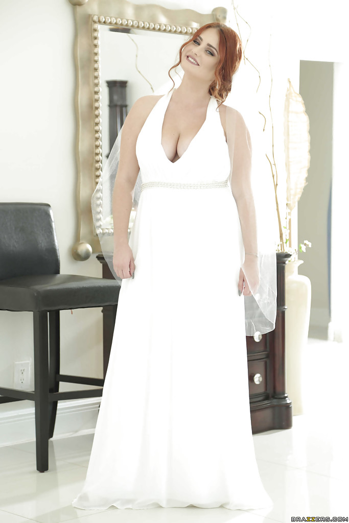 Lennox Luxe displaying large natural tits beneath a wedding dress for the chubby redhead.