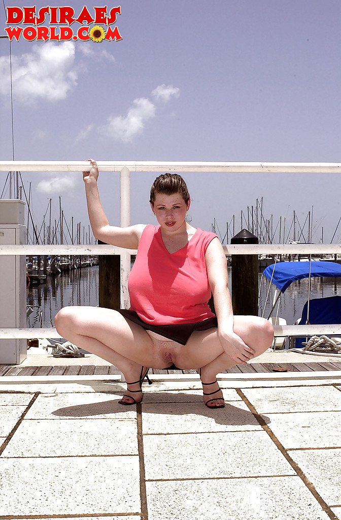 Offshore, Desirae is displaying her substantial breasts and full-length vagina on the boat dock.