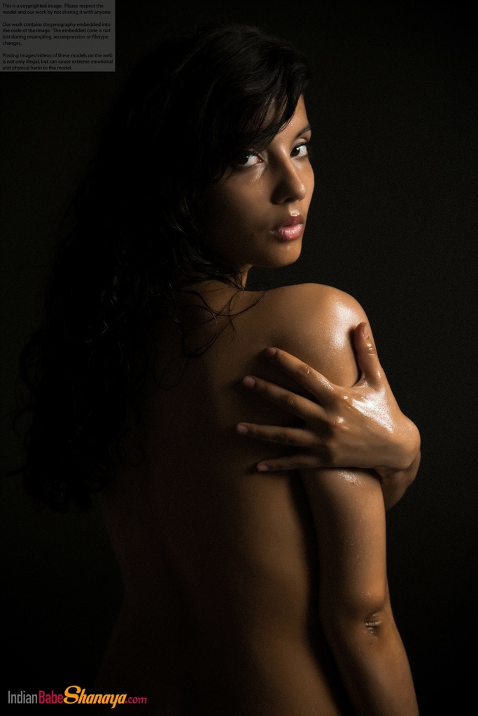 Naked Indian female exposes a single breast while modeling in the dark porn photo #425164308