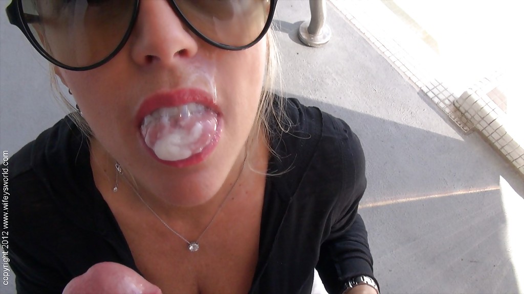 Mature lassie in sunglasses gives a handjob and takes a cumshot on her tongue porn photo #427790374