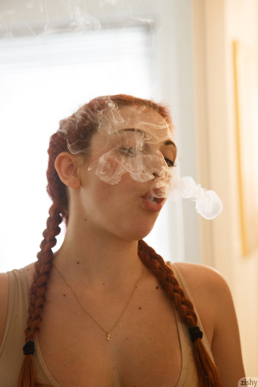 Redhead teen Gina Rosini smokes and shows her big breasts indoors porn photo #424073753